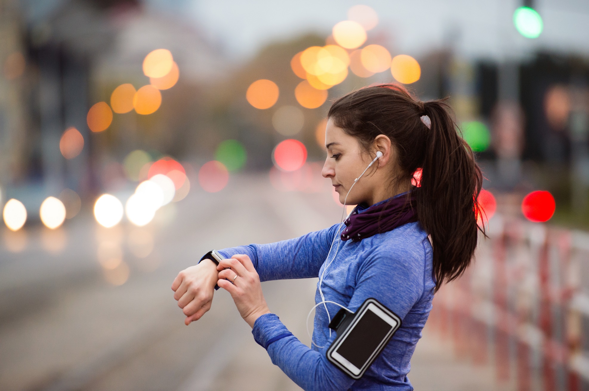 Woman tracking run using app