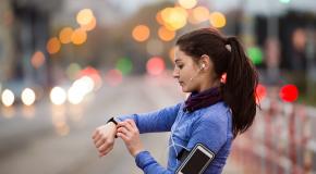 Woman tracking run using app
